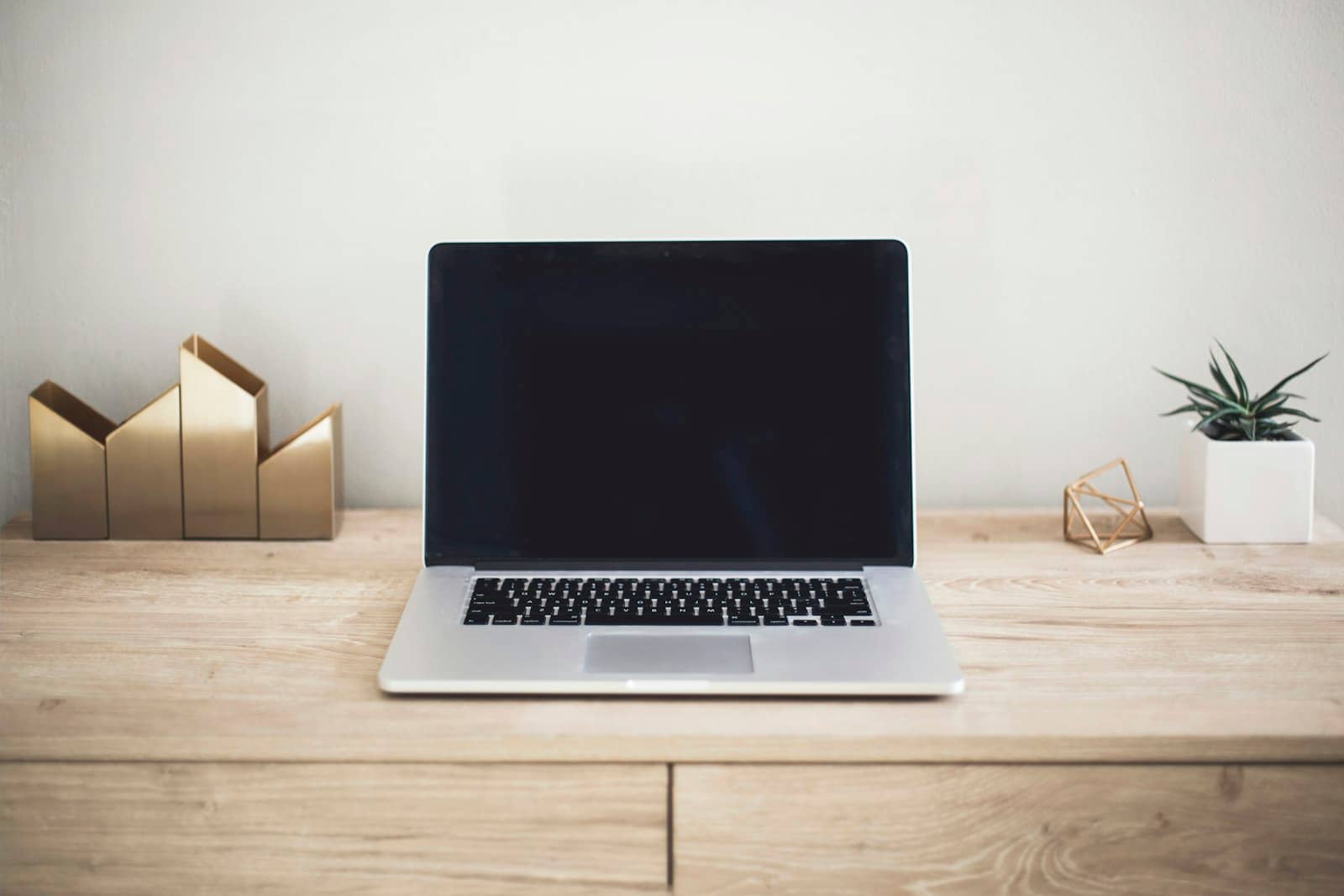 A tidy modern workspace with a laptop