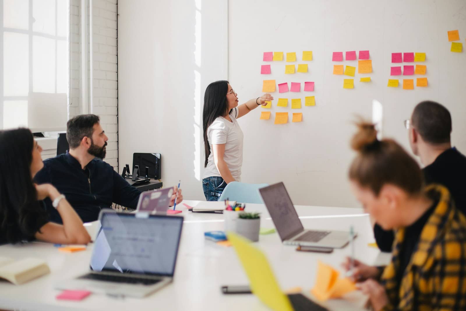 Marketing team reviewing brand materials at a meeting