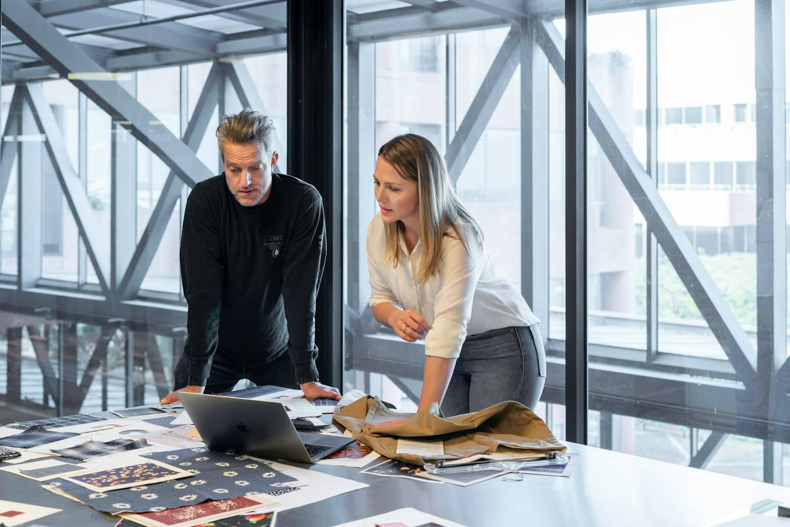 Two people reviewing a plan together at a table