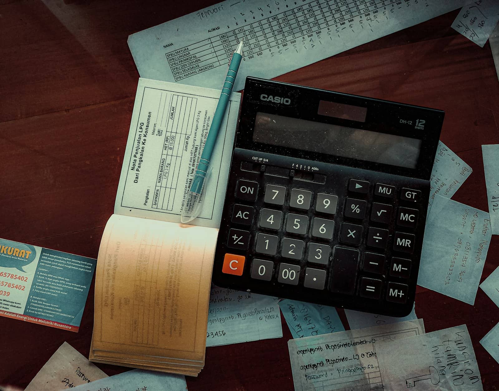 A person reviewing invoices and estimates on a laptop